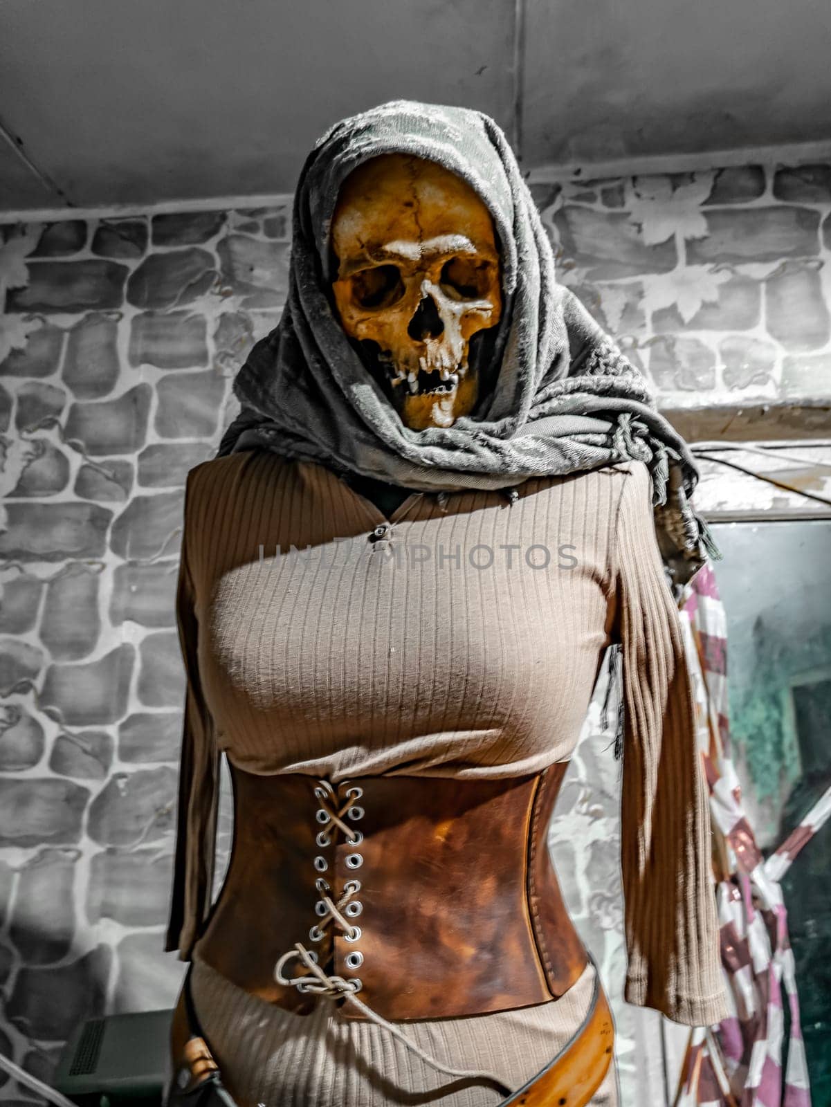 Female skeleton mannequin in stalker clothes