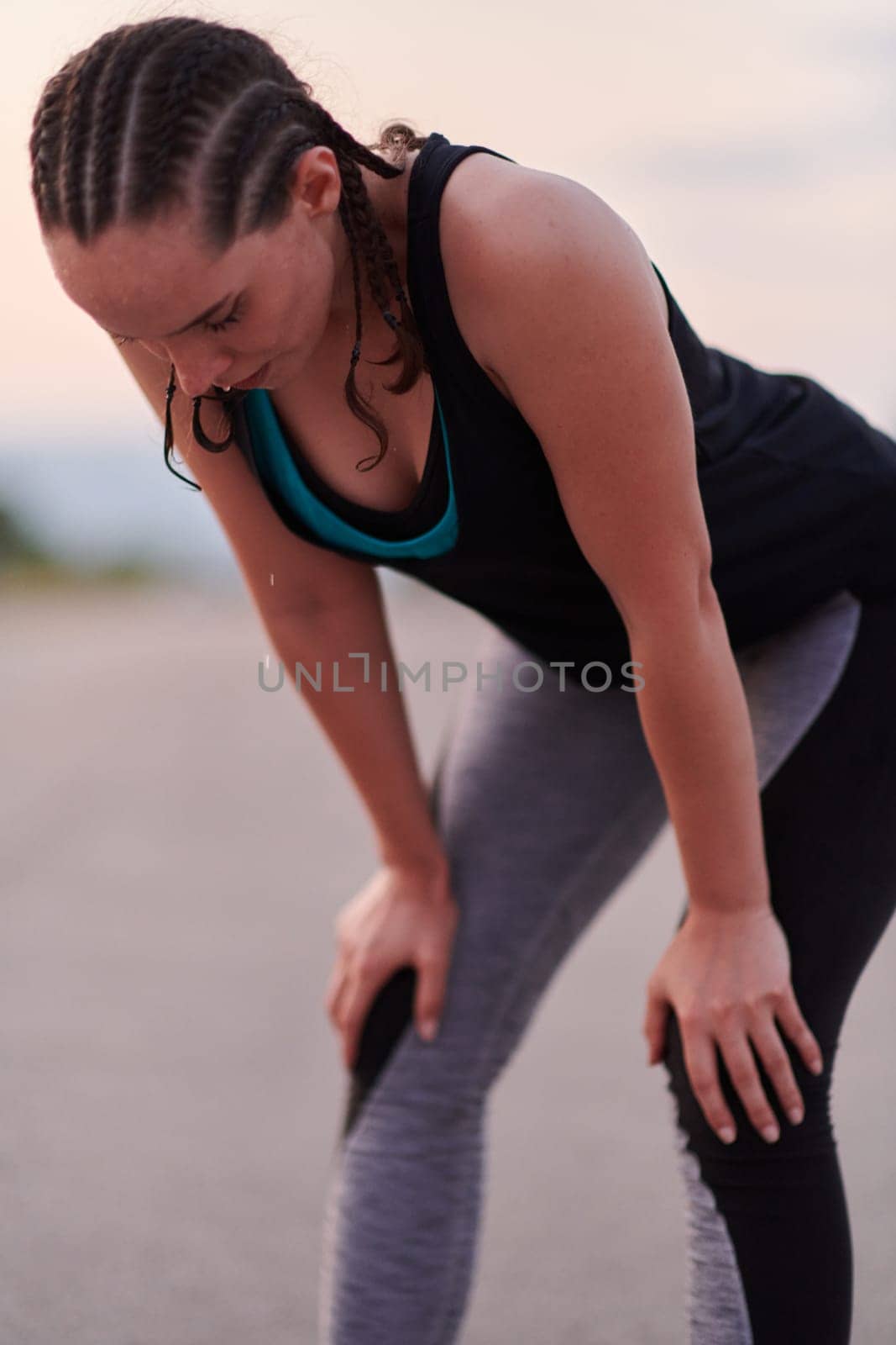 Close-Up Portrait of Determined Athlete Resting After Intense Workout by dotshock