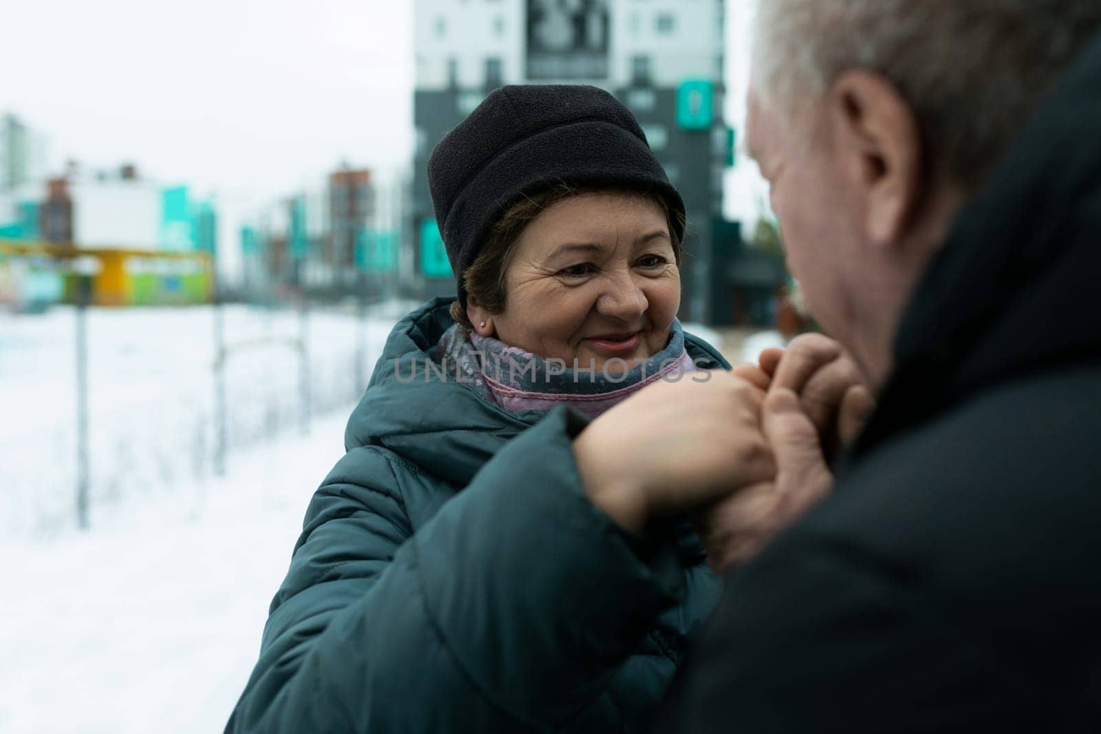 Happy elderly couple walking in the park and confessing their feelings.