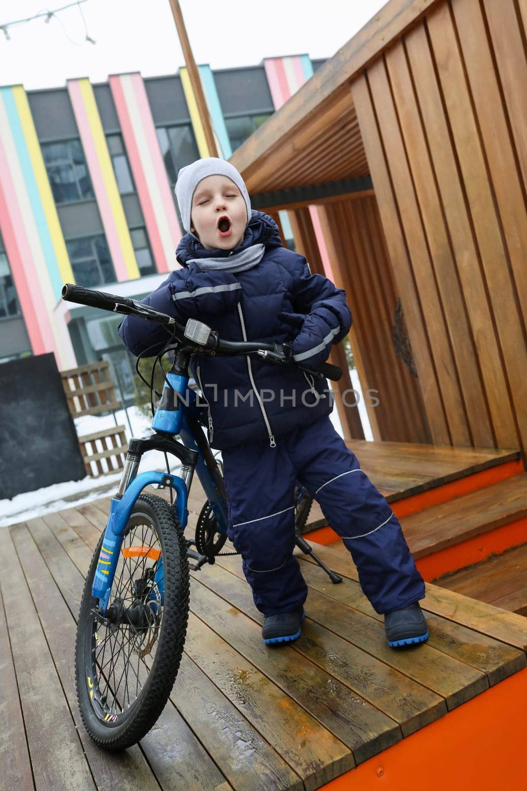 Lifestyle concept, boy with bicycle on the street.