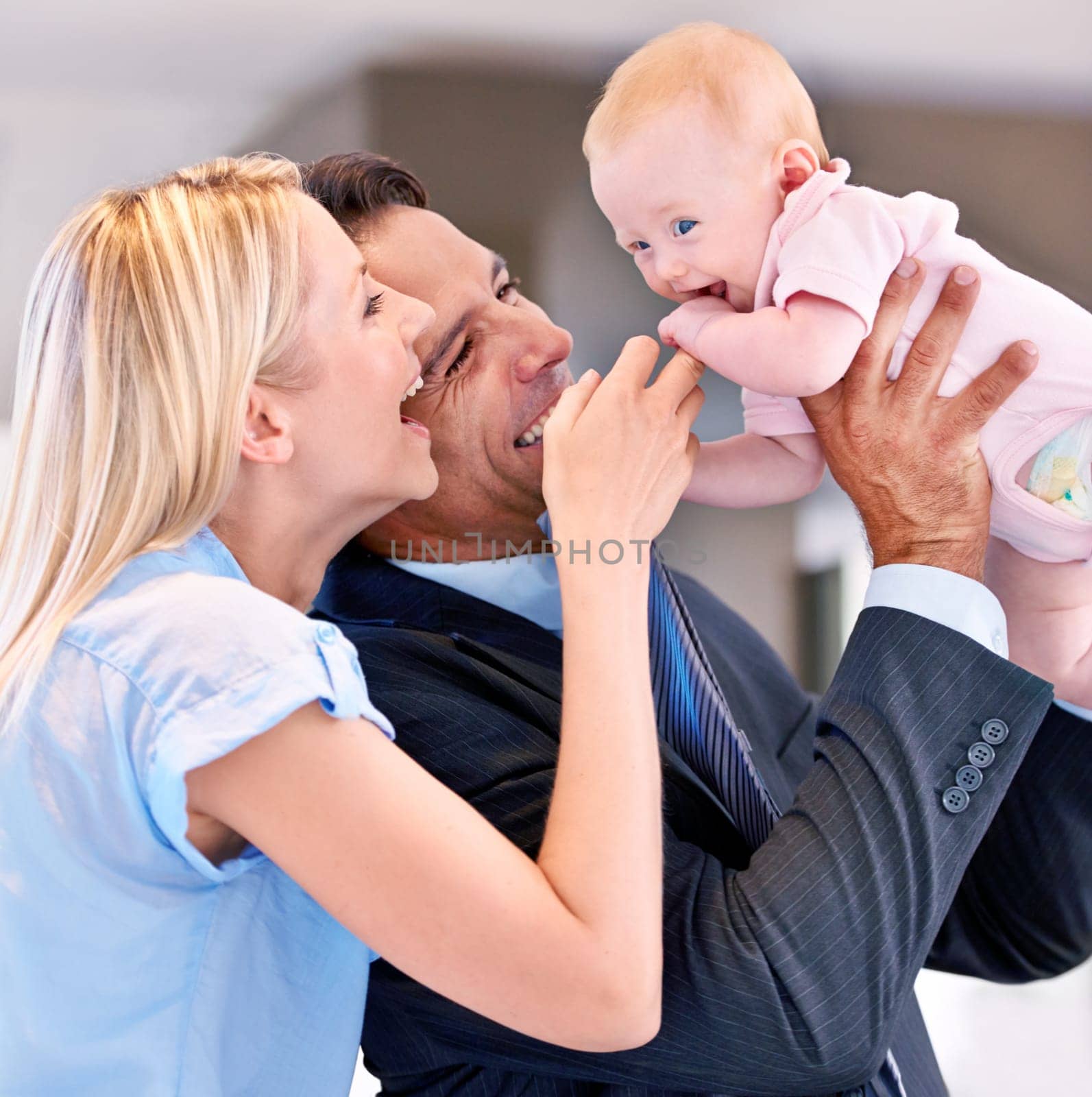 Family, happy and parents with baby in living room for bonding, affection and childcare at home. Infant, smile and cheerful for interaction with mother, father and healthy relationship in house.