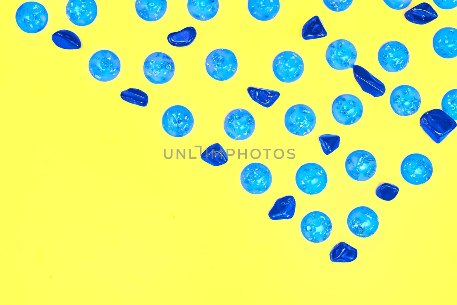 Blue azure emerald stones pebble gems pattern.Yellow space for advertising text by jovani68