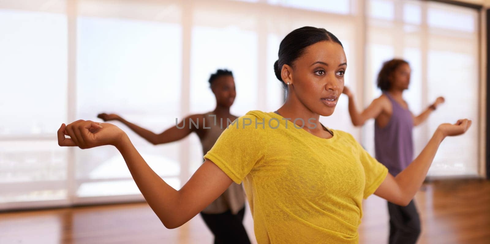 Dancer, woman and training for learning, exercise and fitness in a dance studio with movement routine. People and performance workout of woman with ballet and wellness in a performing arts class.