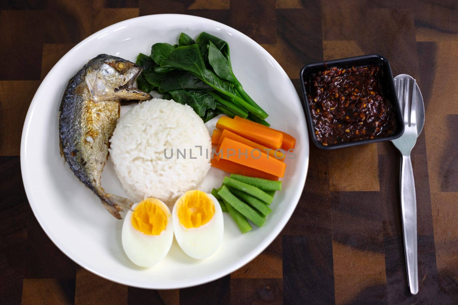 Stir Fried Mackerel With Chili Paste And Boiled Vegetables On Steamed Rice.