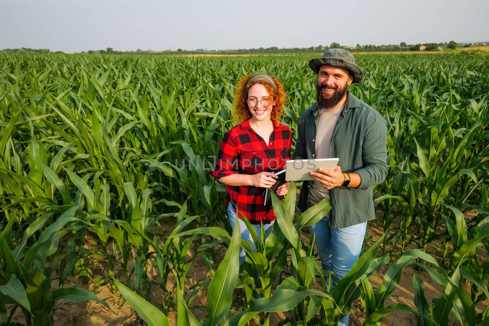 Portrait of farmers who are cultivating corn. Agricultural occupation.