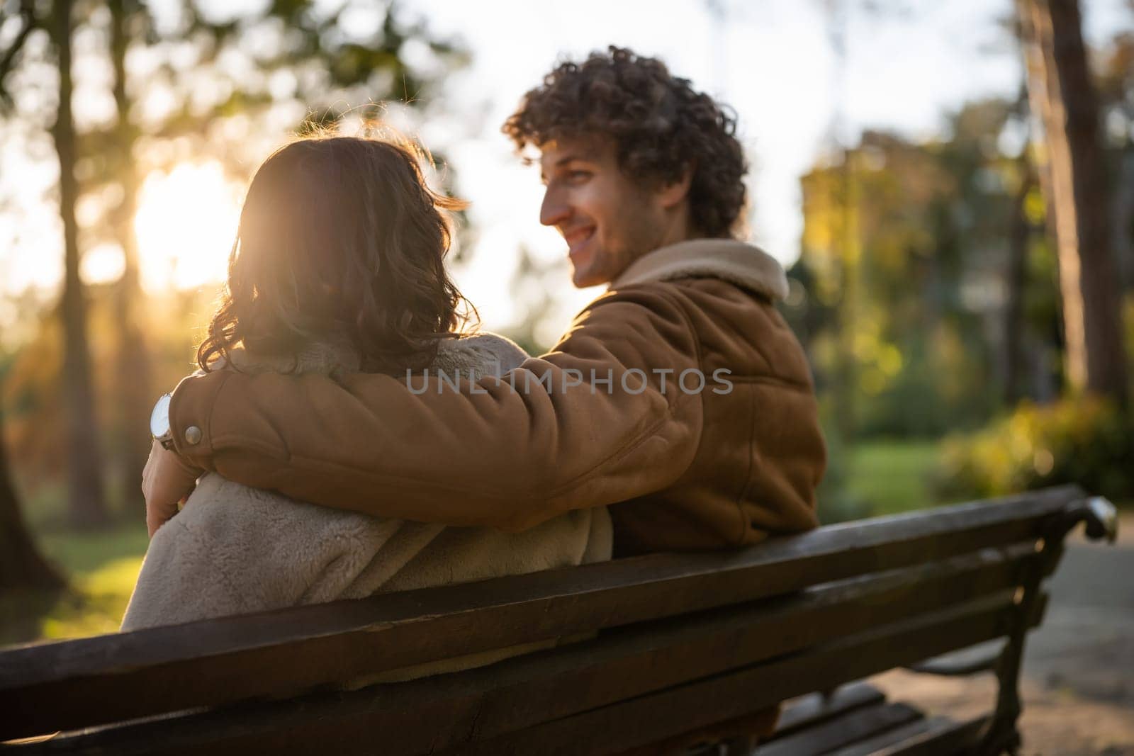 Happy loving couple enjoying their time together in park.