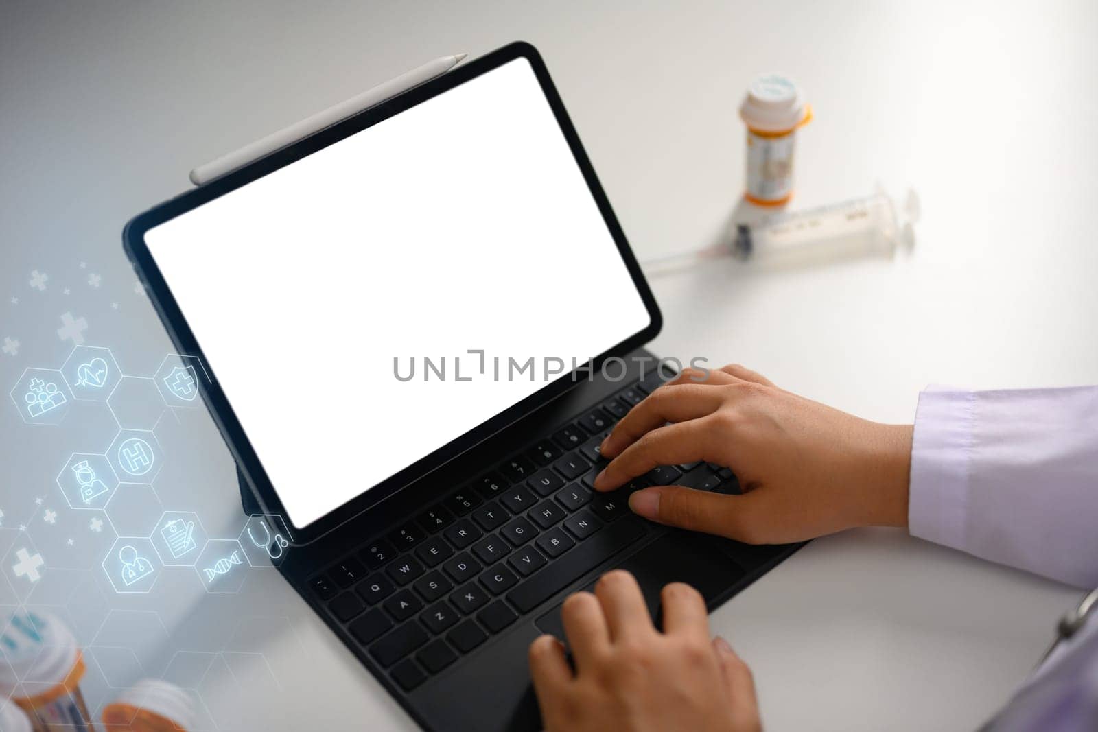 Closeup doctor typing on digital tablet using network connect to the internet. Medical technology concept.