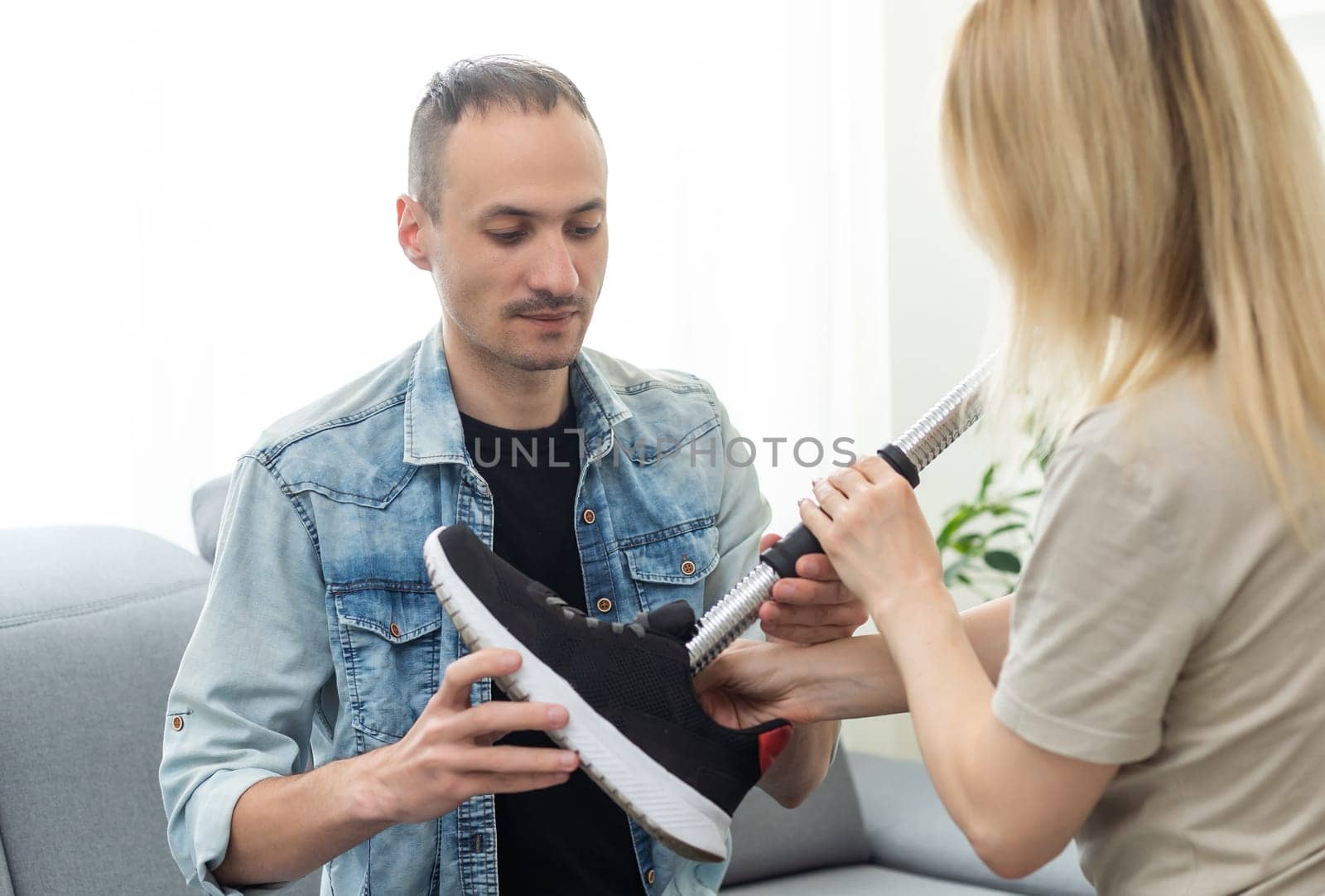 Technician testing robotic bionic leg at prosthetic manufacturing. High quality photo