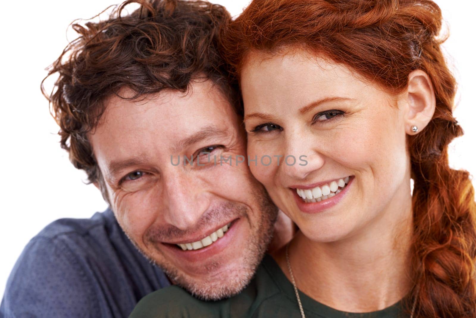 Couple, portrait and hug for romance in studio, support and smile for relationship on white background. Happy people, commitment and trust in security of marriage, closeup and embrace for anniversary.