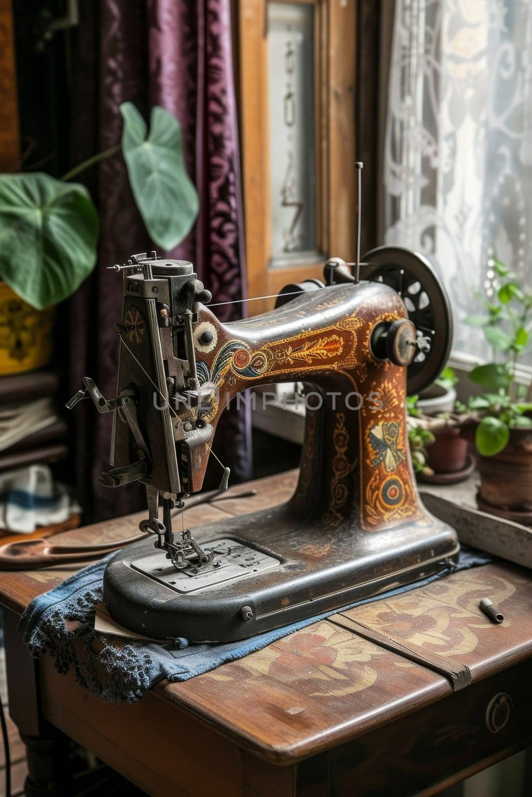 An antique sewing machine is ready to work on the table by Lobachad