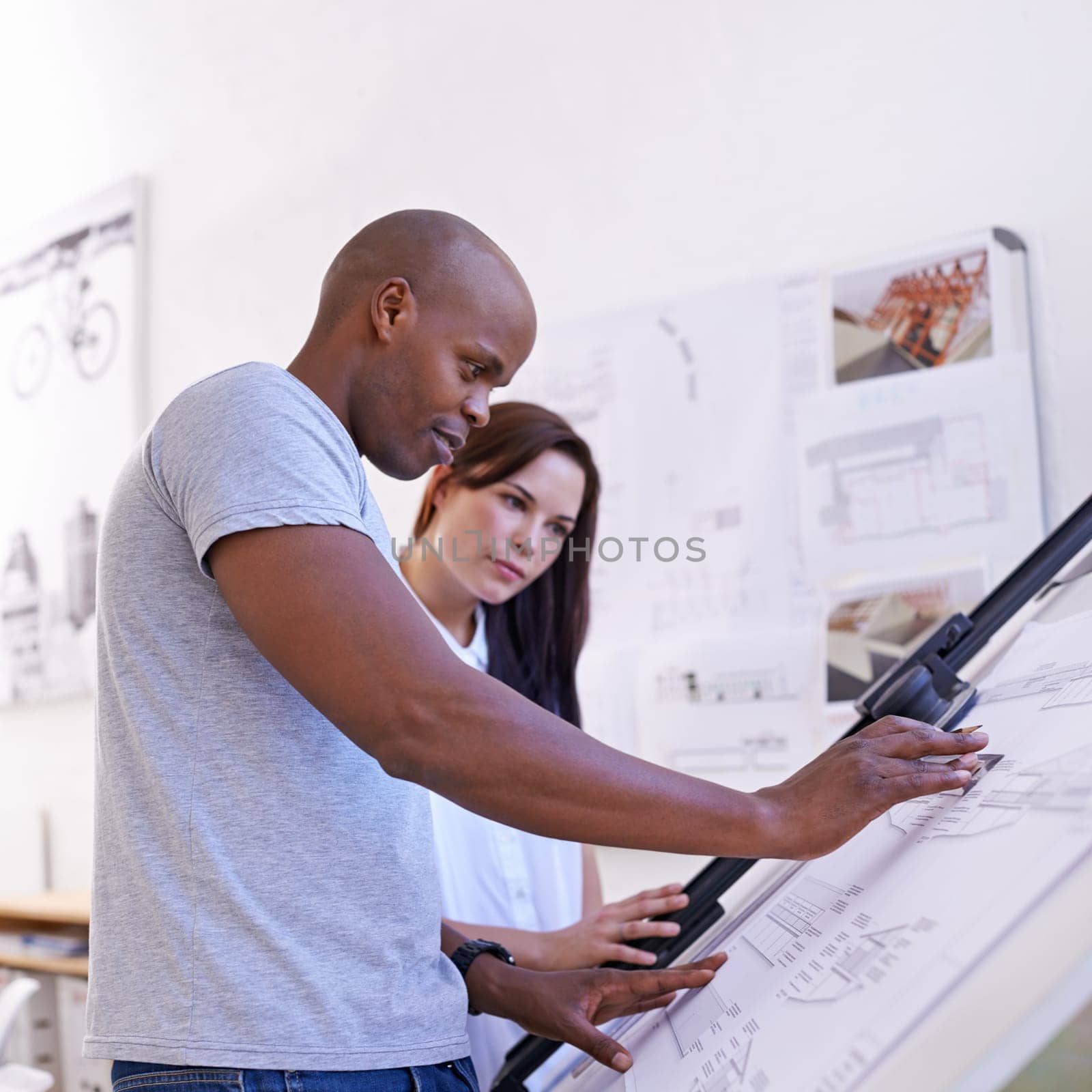 Architecture, man and woman with blueprint on drawing board in office for building design and remodeling project. Business people, collaboration or happy architect with development planning or layout.