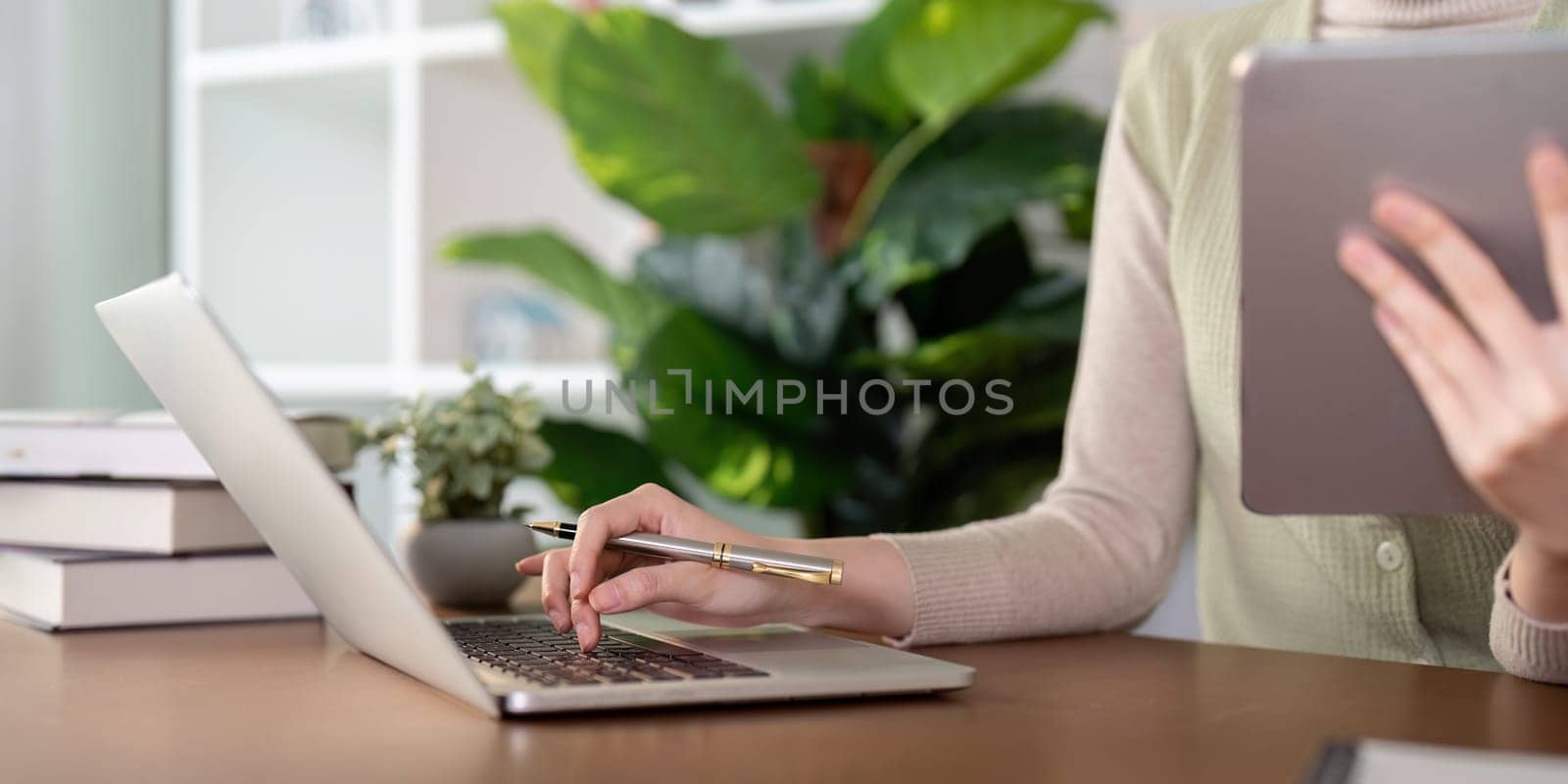 Woman creative in home office and laptop for research in remote work, social media or blog in home office. Freelance at desk with computer writing email, website post and online chat in house.