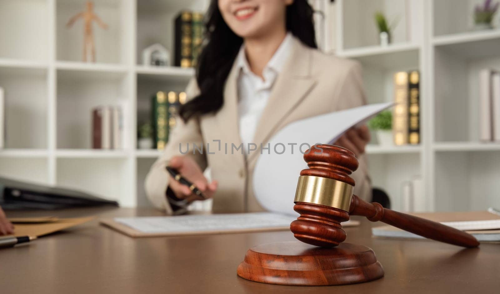 Lawyer and businesswomen discussing and introducing Providing legal advice regarding signing insurance contracts or financial contracts by wichayada