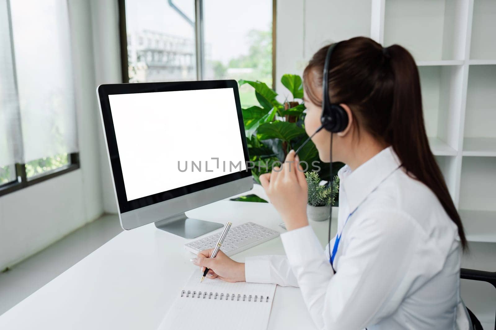 Customer service, woman and happy call center agent giving advice online using a headset. blank white screen computer.