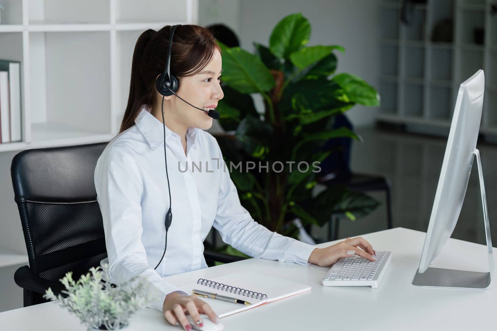 Customer service, woman and happy call center agent giving advice online using a headset by itchaznong