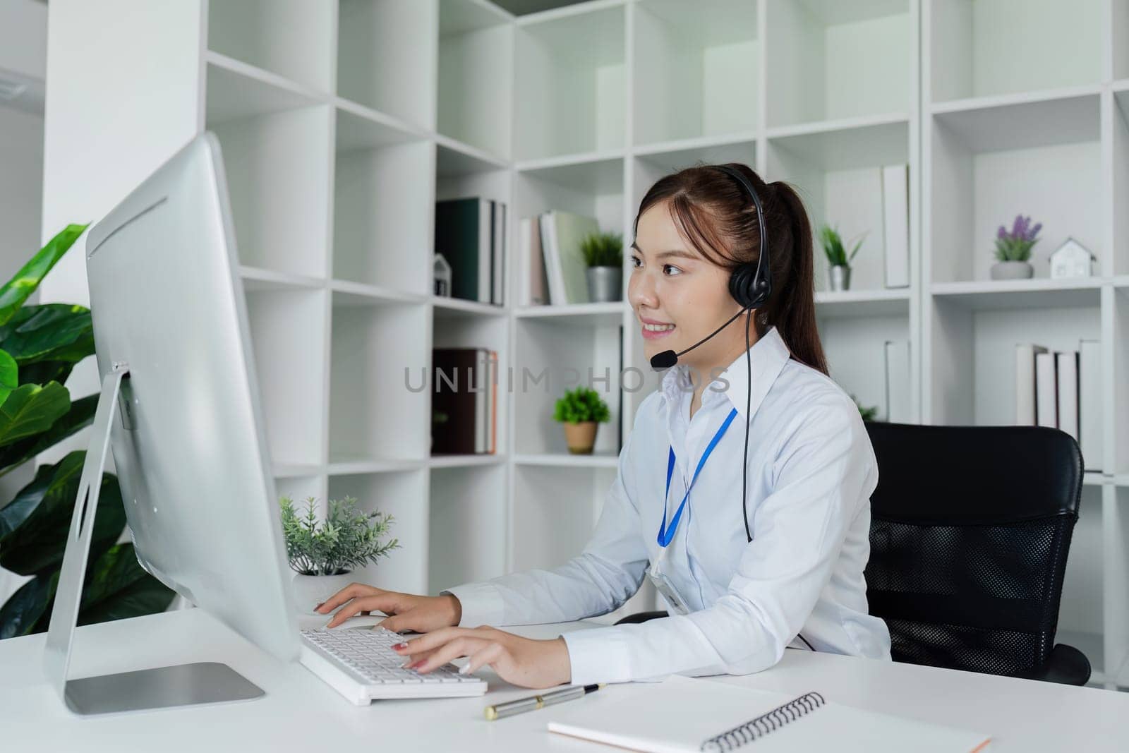 Customer service, woman and happy call center agent giving advice online using a headset by itchaznong