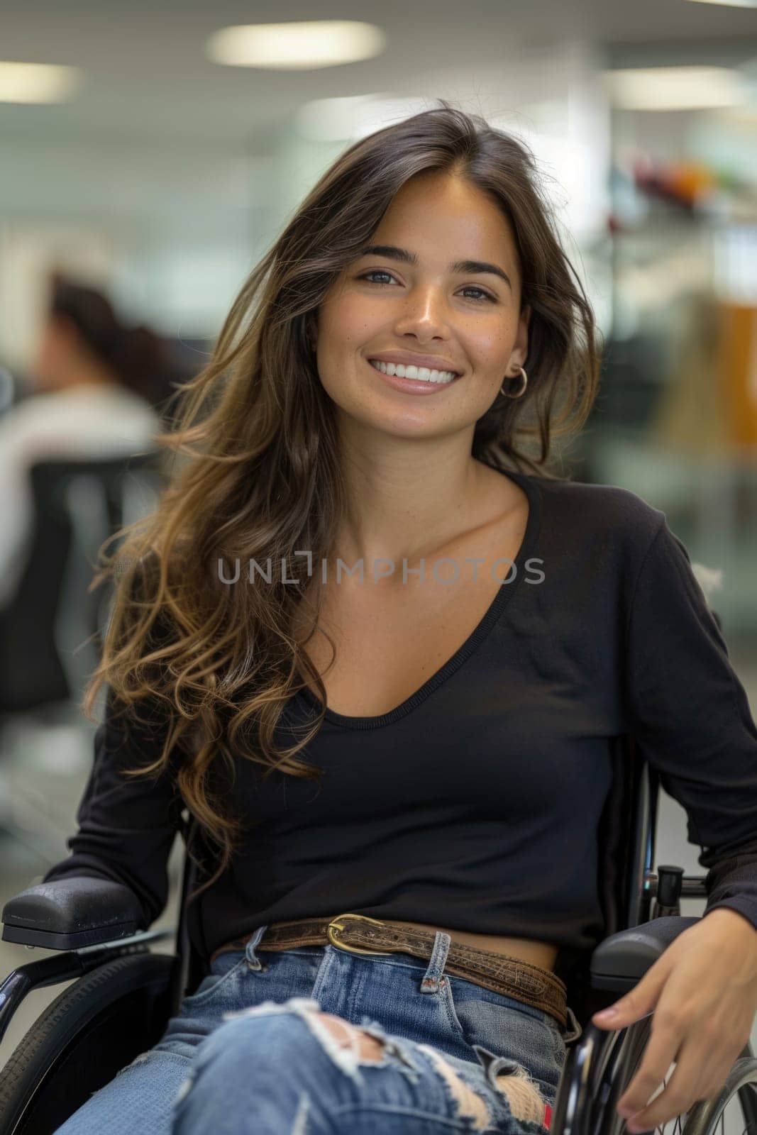 Smiling young woman in wheelchair, at work in the office, free space. ai generated