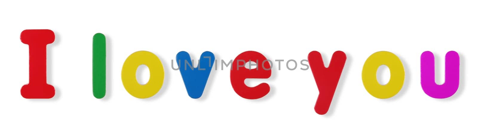 I love you words in coloured magnetic letters on white with clipping path to remove shadow