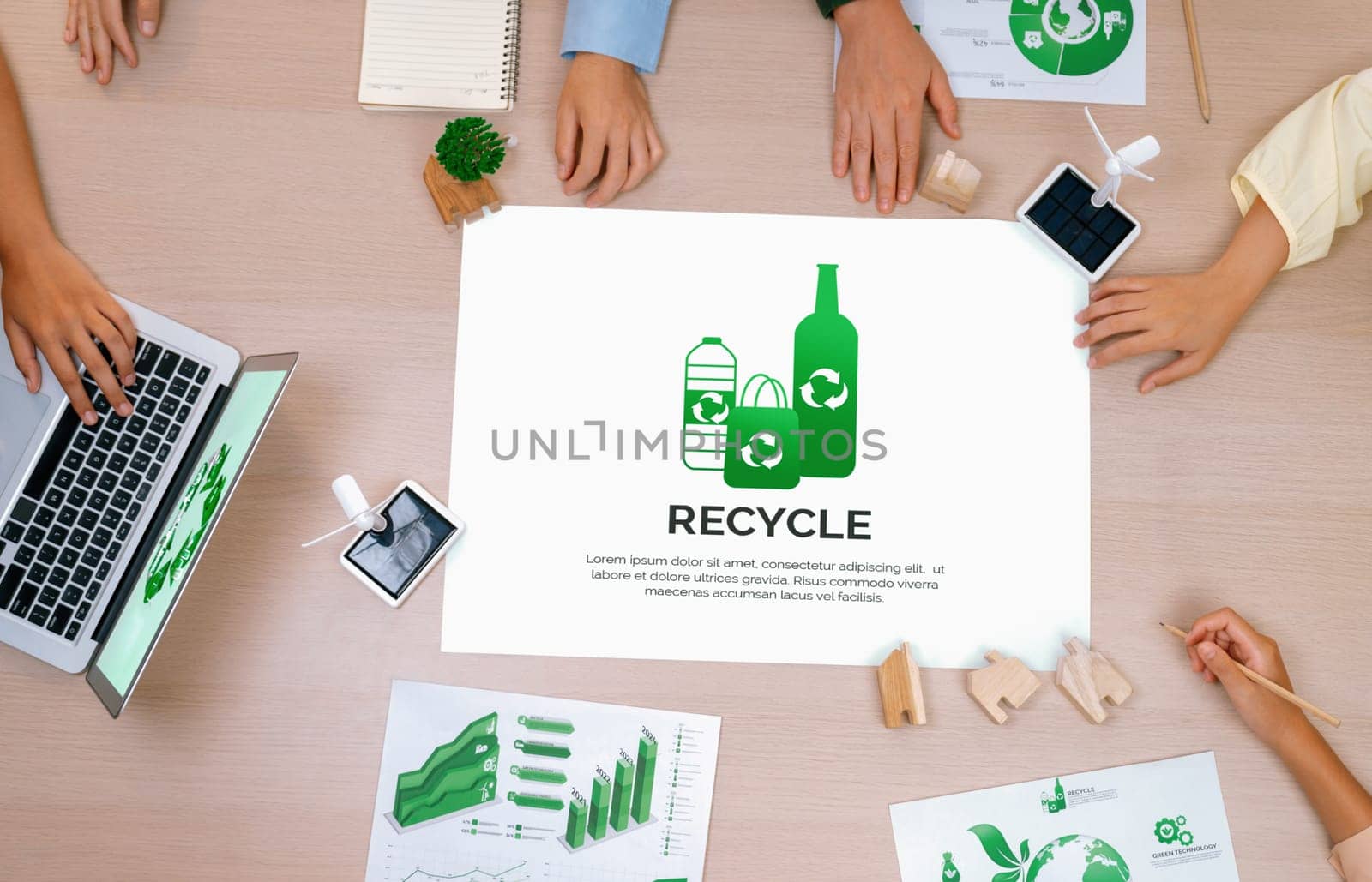 Recycle packaging placed on a meeting table during a green business meeting discussion. ESG environment social governance and Eco conservative concept. Top view. Delineation.