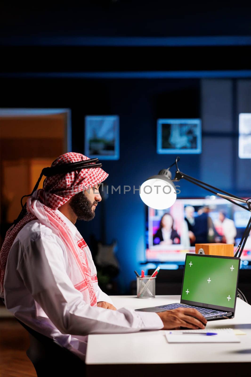Arab Man with Green Screen on Laptop by DCStudio