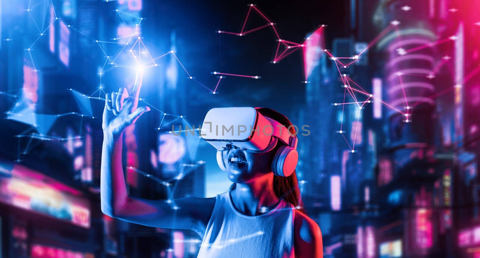 Female stand in cyberpunk style building in meta wear VR headset connecting metaverse, future cyberspace community technology, Woman using index finger touch virtual object while smile. Hallucination.