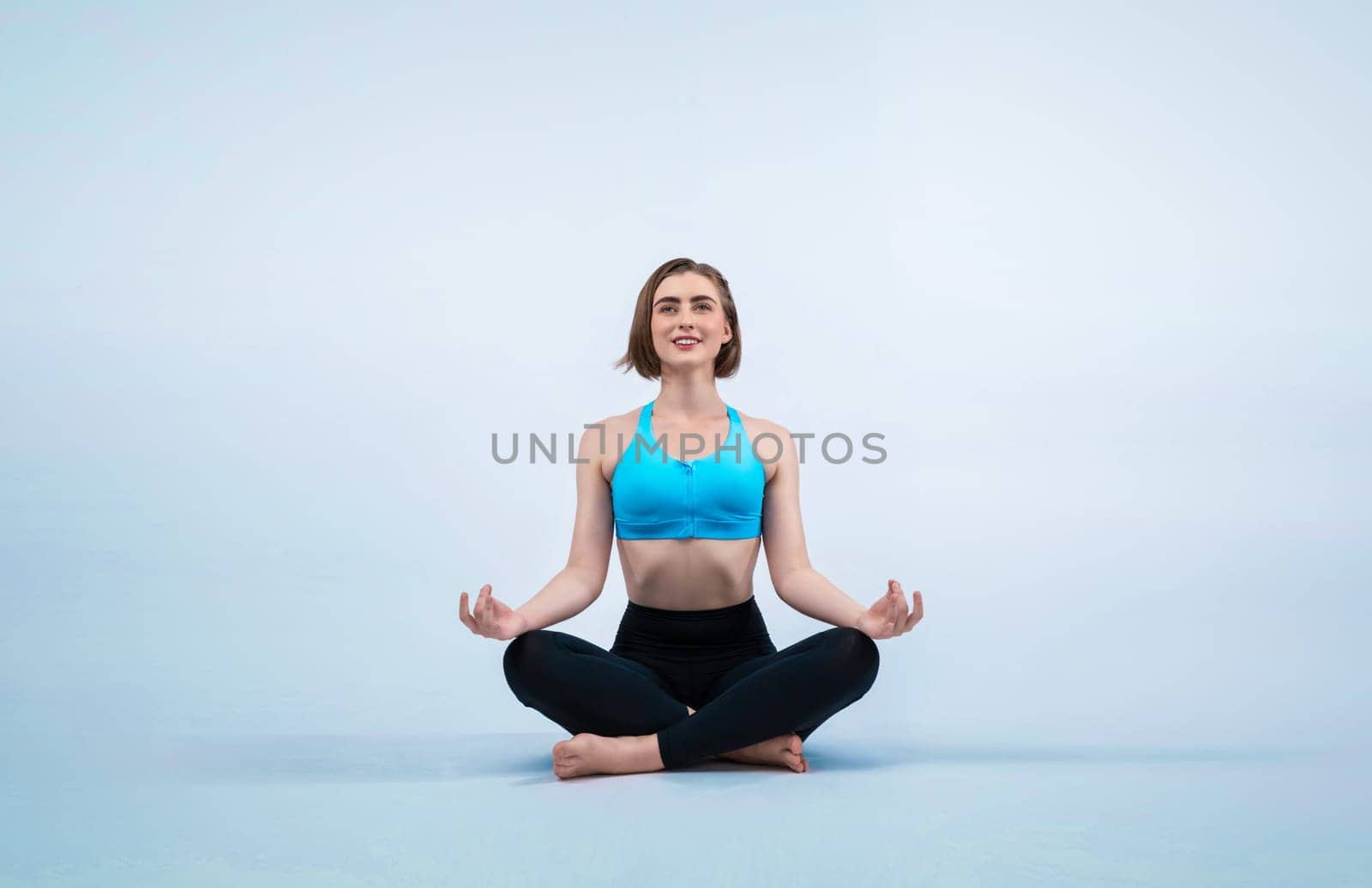 Full body length gaiety shot athletic and sporty woman doing healthy and meditative yoga exercise workout posture on isolated background. Healthy active and body care lifestyle