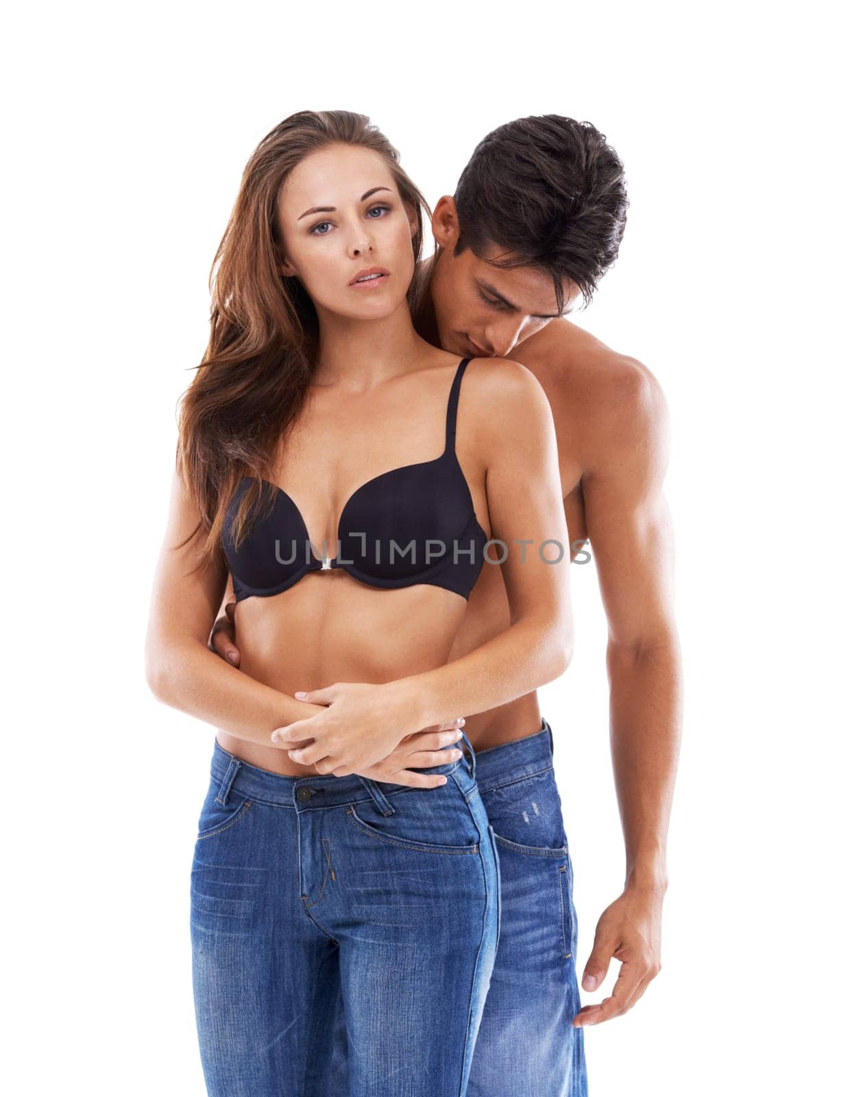 Portrait, hug and couple sexy in studio for love or bonding, close and sultry with seduction for relationship. Man, woman and together on white background for compassion, romance and embrace
