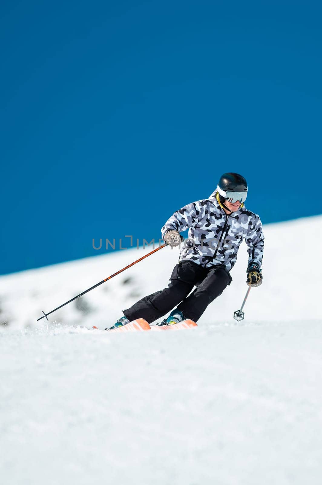 Expert skier on the slopes of Grandvalira in Andorra in Winter 2024.