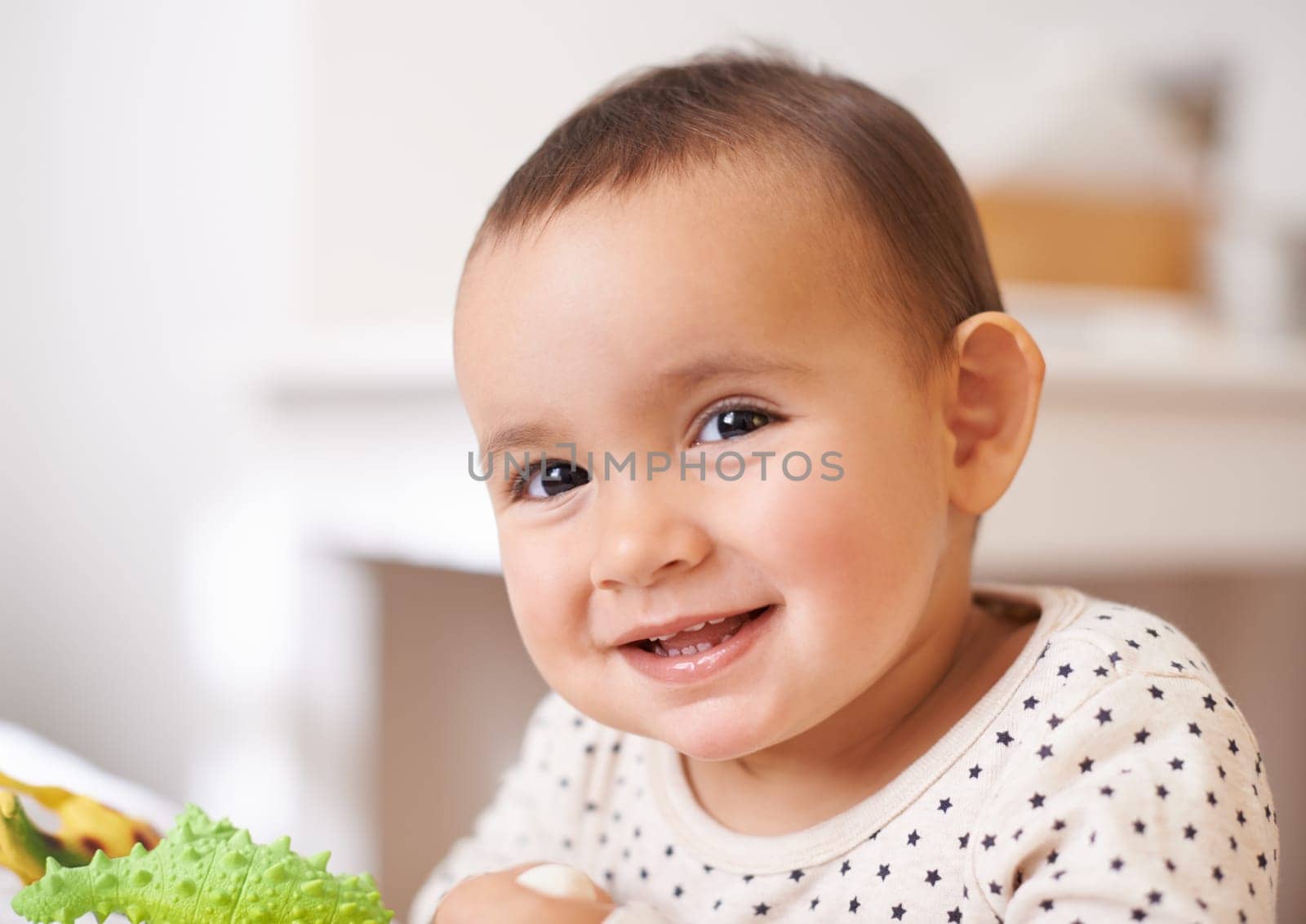 Baby, toddler portrait and toy in home, childhood and care for enjoyment in bedroom. Girl, kid and happy for child development and relax in nursery, plastic animal and play games or entertainment.