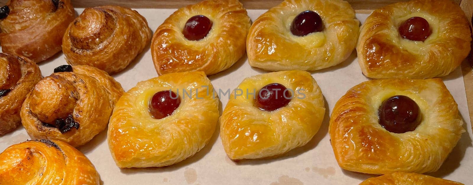 freshly baked danish pastry with apricot jam fruity jelly super delicious warm fresh buttery baked pastries with apricot and peach from baker's kitchen