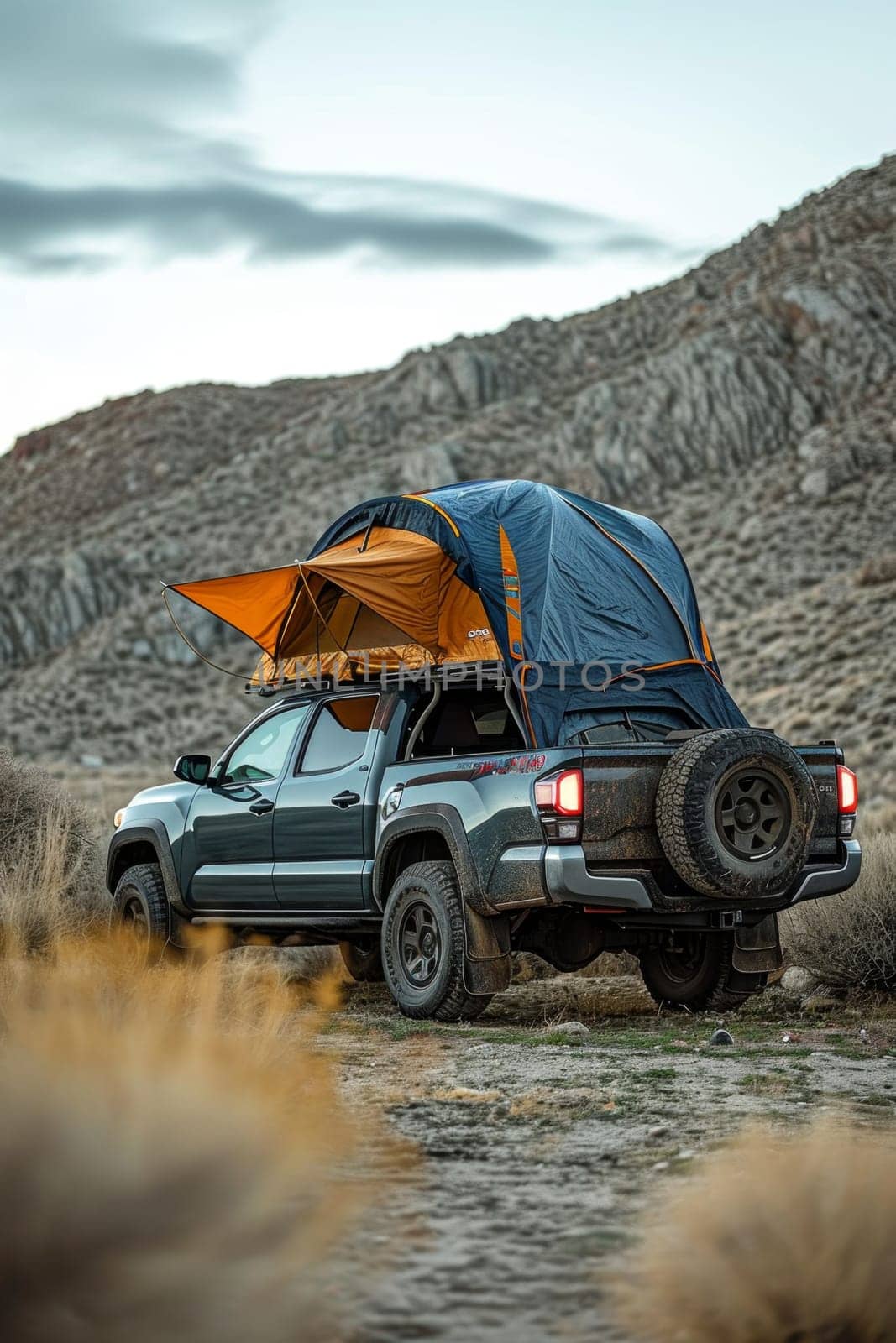 An SUV with a tent on the roof in the wild. Traveling by car.