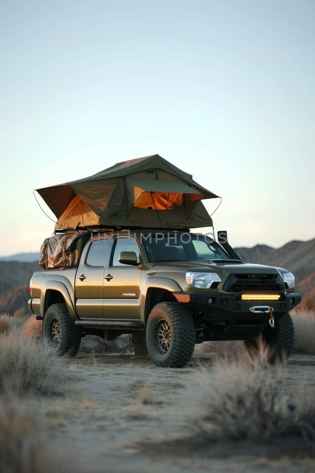 An SUV with a tent on the roof in the wild. Traveling by car.