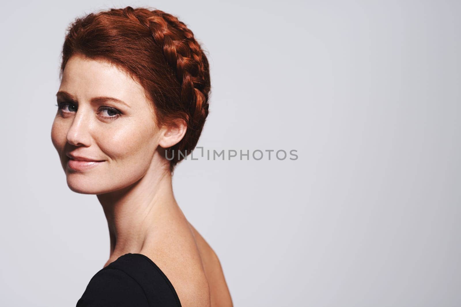 Woman, hair and portrait with braid crown for beauty, elegant hairstyle for glamour and redhead on white background. Haircare, shine and texture with luxury and plait, cosmetic care and mockup space by YuriArcurs