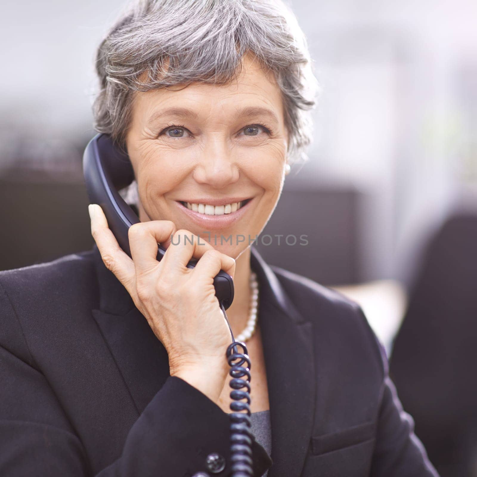 Senior woman, portrait and telemarketing phone call with communication and smile from work. Crm, telephone and support with conversation and professional female employee with talking in office by YuriArcurs