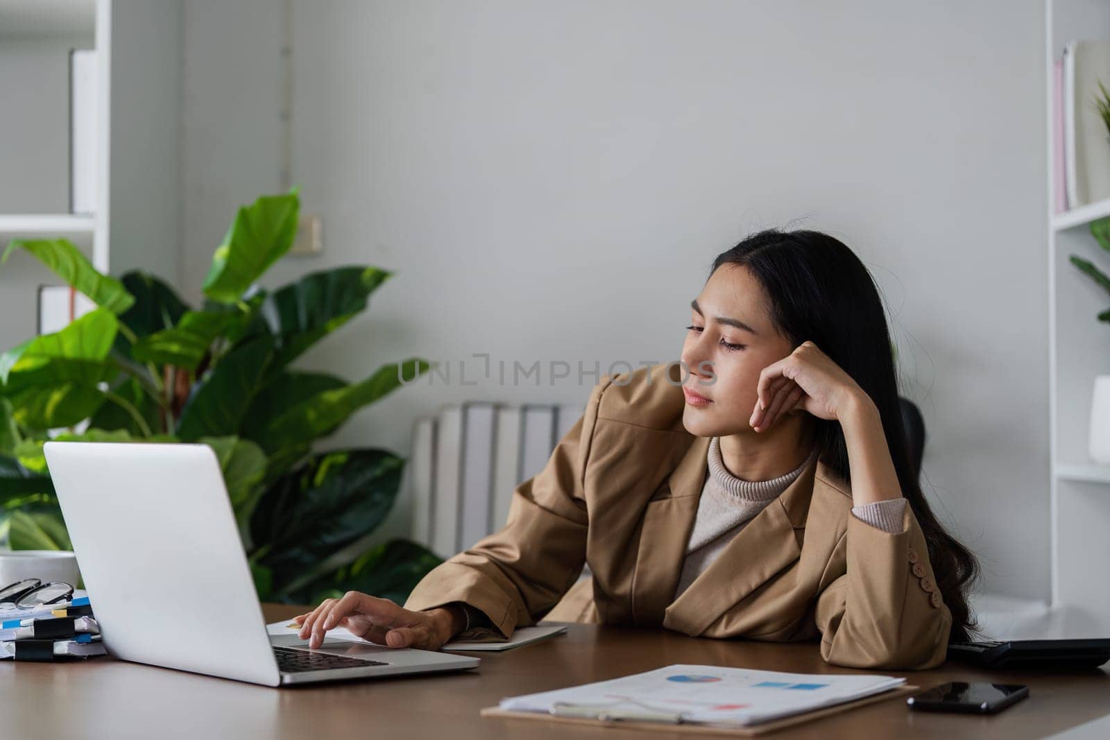 business woman entrepreneur in office using laptop at work, professional female company executive boring working on computer at workplace.
