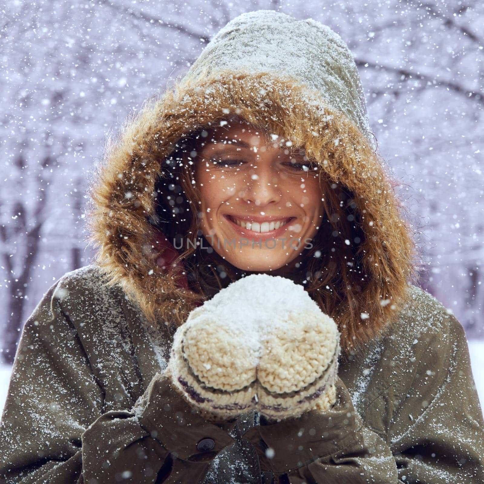 Snowball, excited and face of woman with snow outdoors for season, snowing weather and cold climate. Travel, fashion and happy person in nature on winter holiday, vacation and weekend in Switzerland.