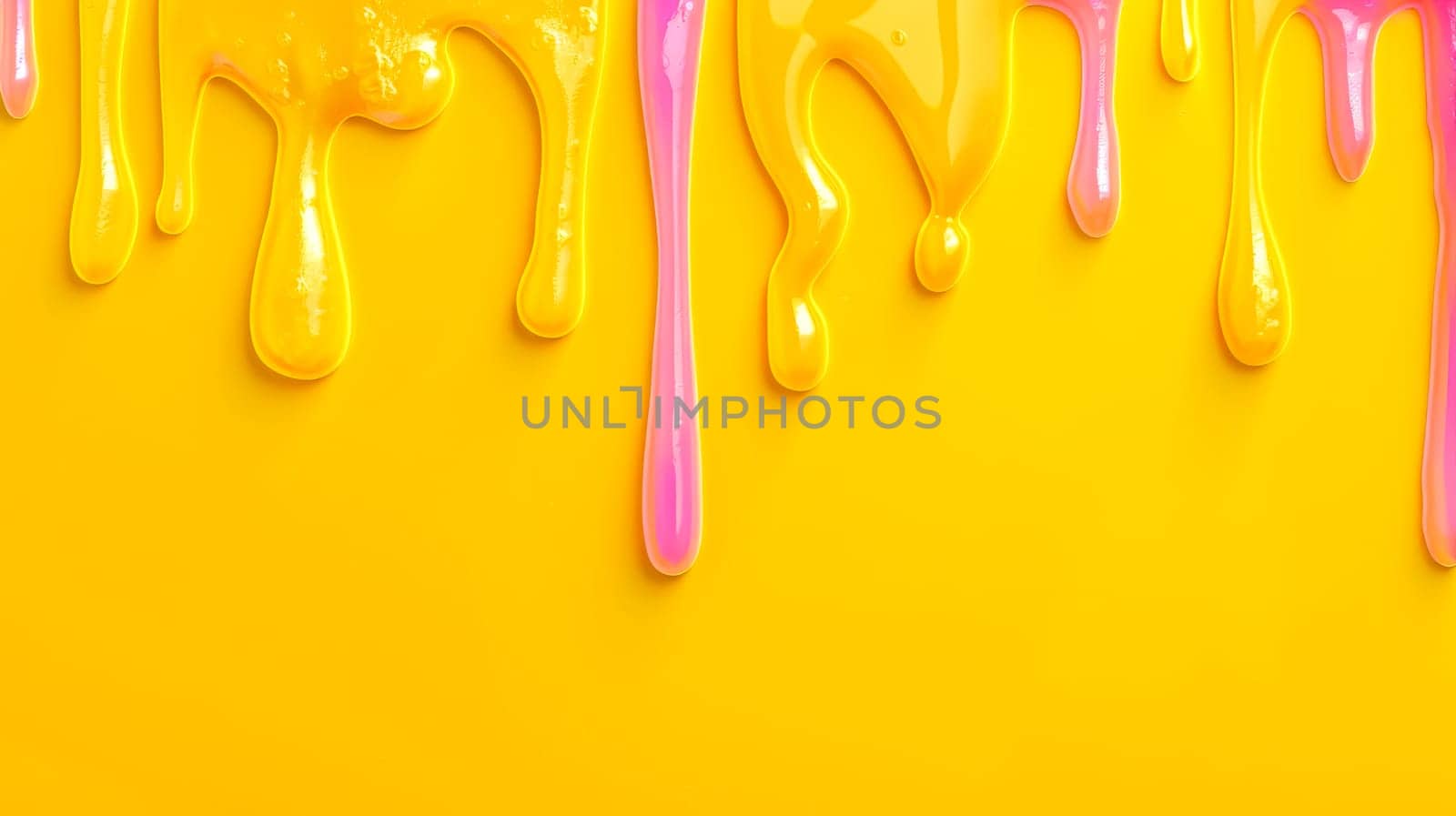 Vibrant yellow and pink paint drips on glossy surface by Edophoto