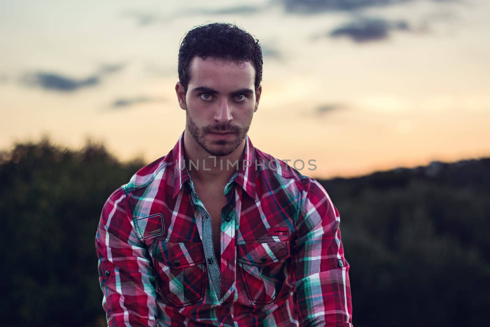 Man in red and green plaid shirt by artofphoto