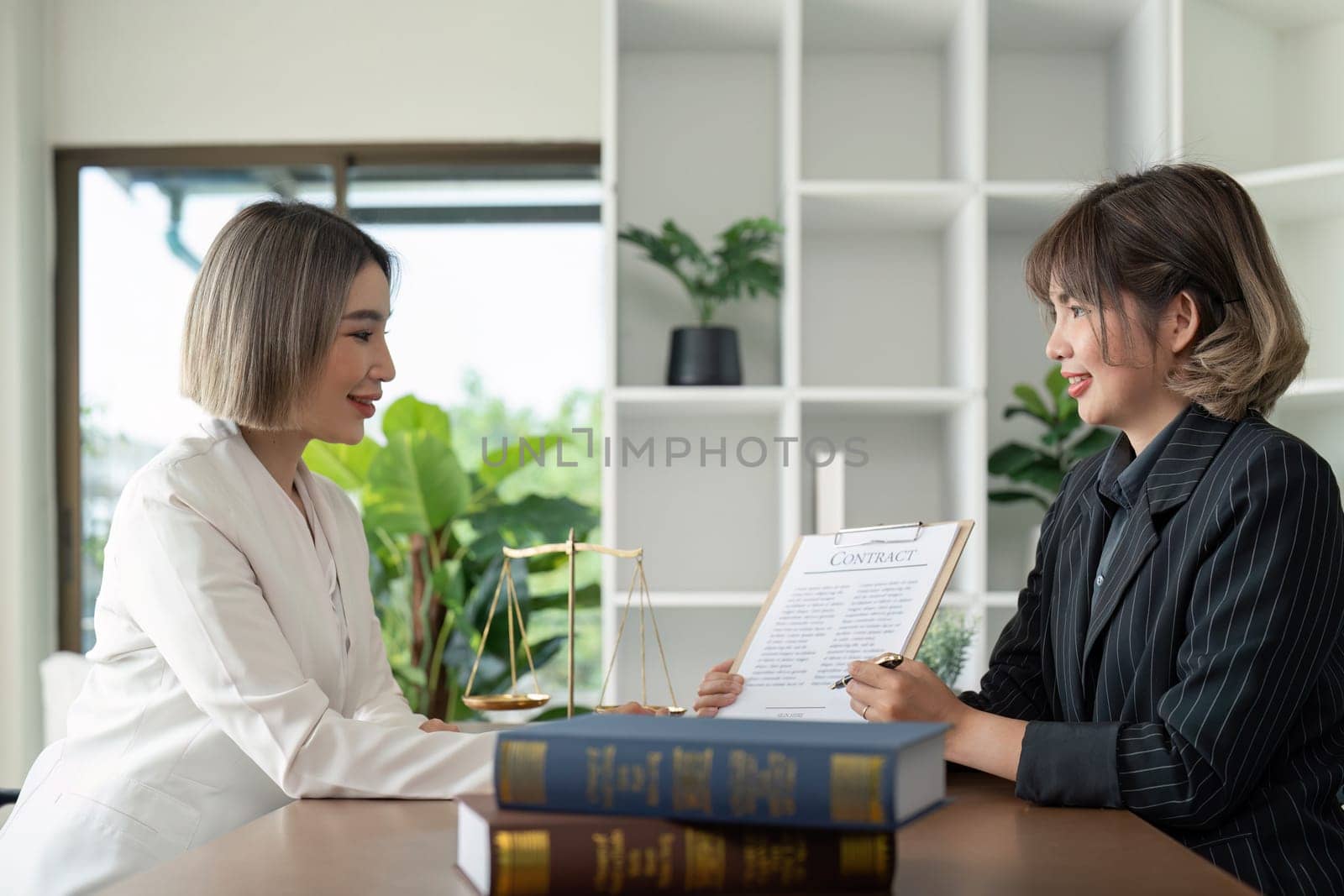 Company hired the lawyer office as a legal advisor and draft the contract so that the client could signs the right contract. Contract of sale was on the table in the lawyer office.
