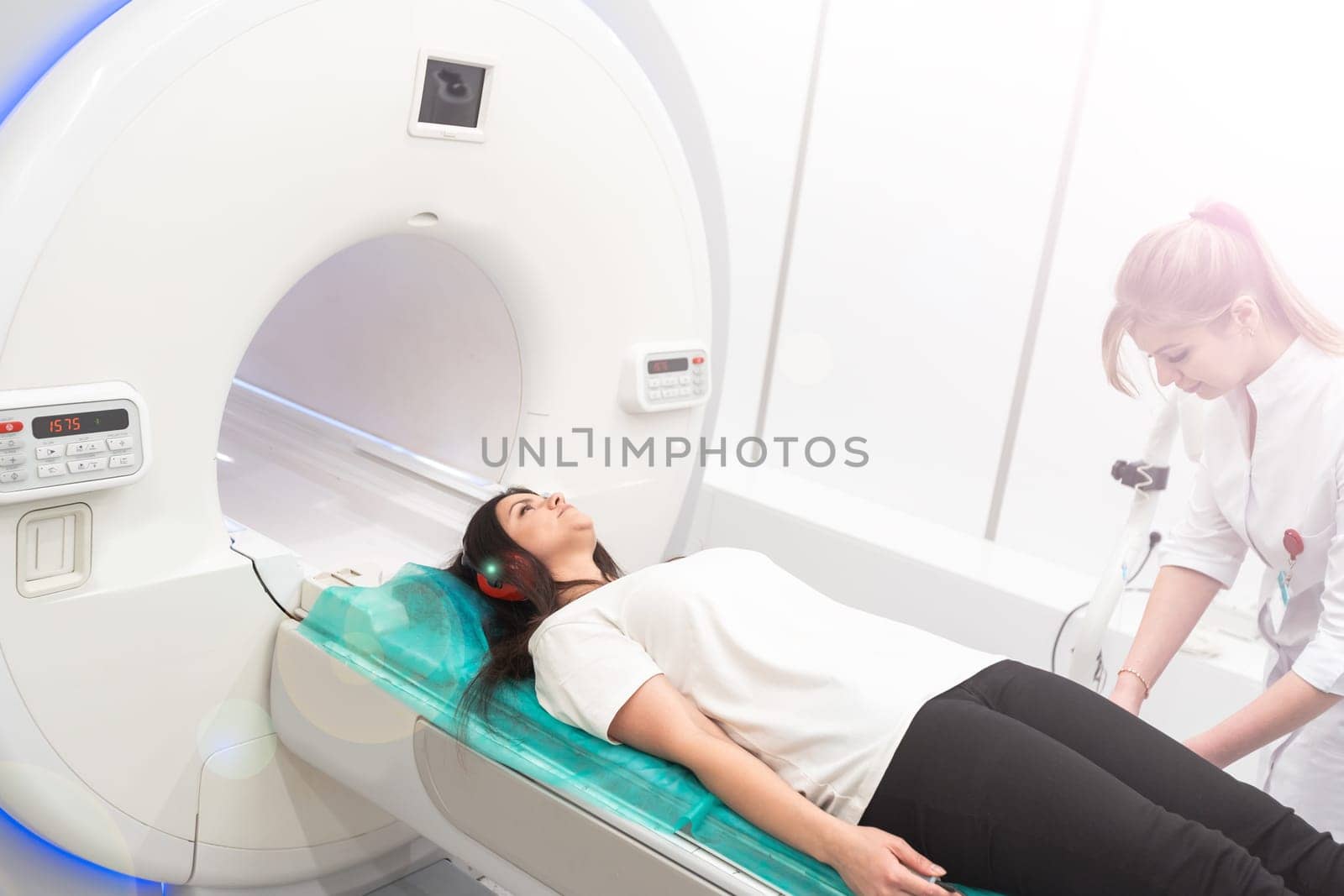 Medical CT or MRI Scan in the modern hospital laboratory. Interior of radiography department. Technologically advanced equipment in white room. Magnetic resonance diagnostics machine.