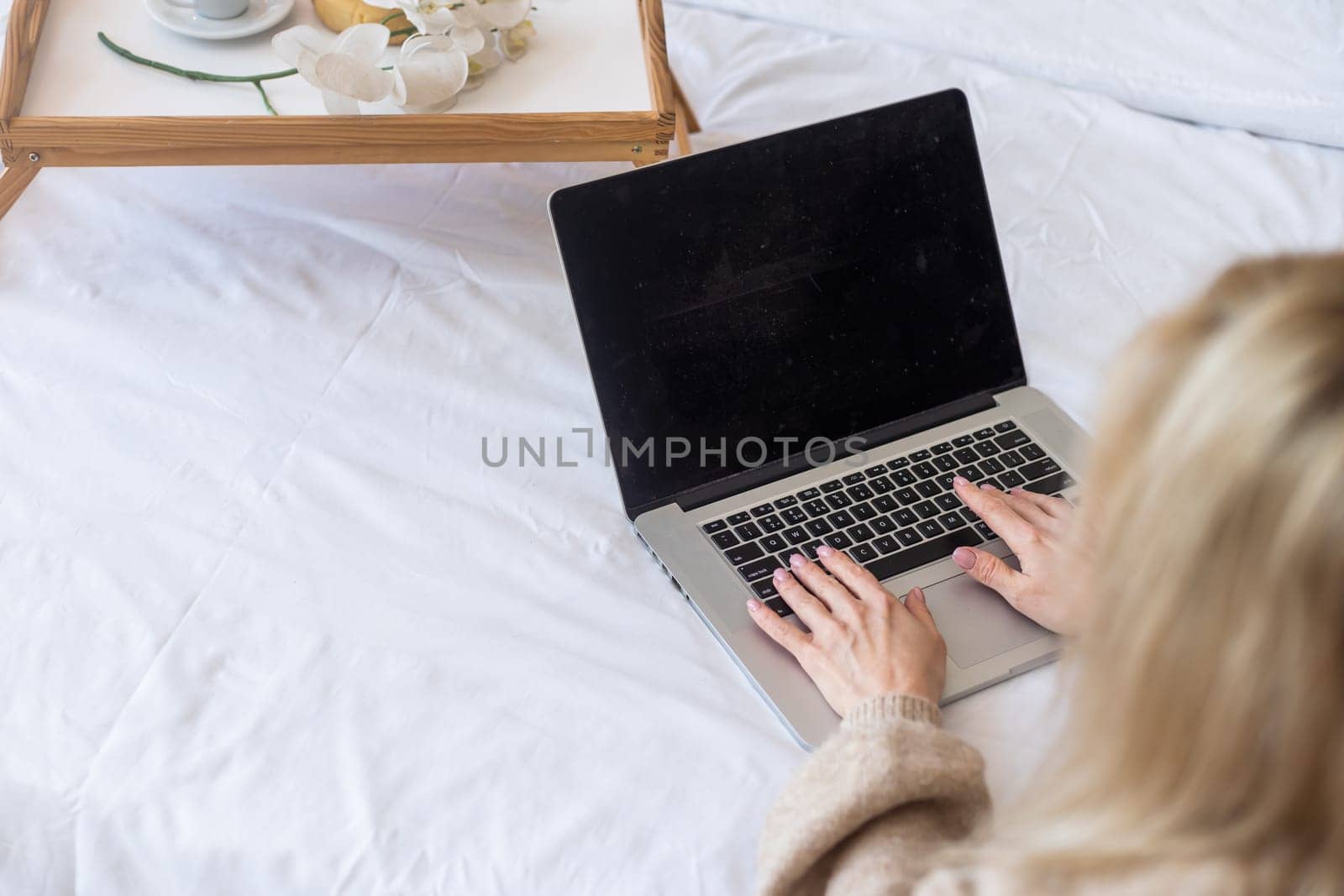 People, lifestyle, modern technology and communication concept. Young Caucasian female working online by Andelov13