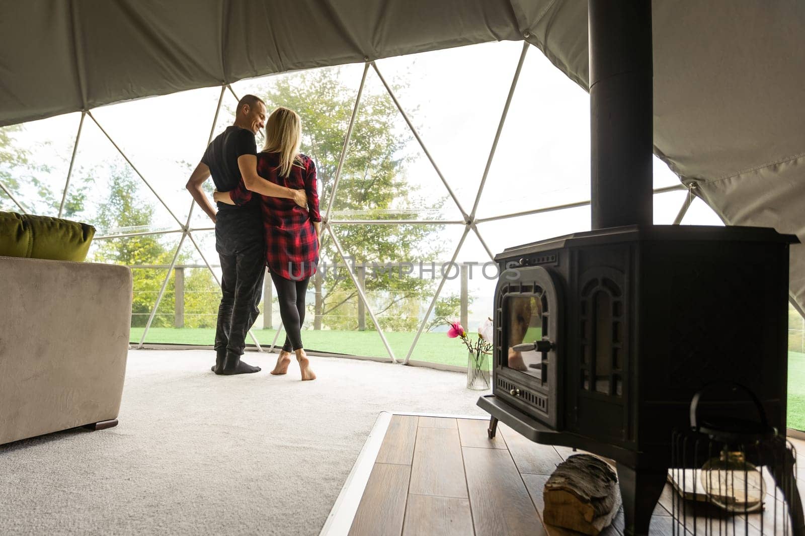 a couple dancing in geo dome tents