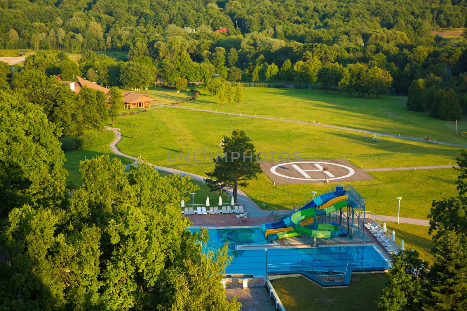 peak helipad and swimming pool under sunset