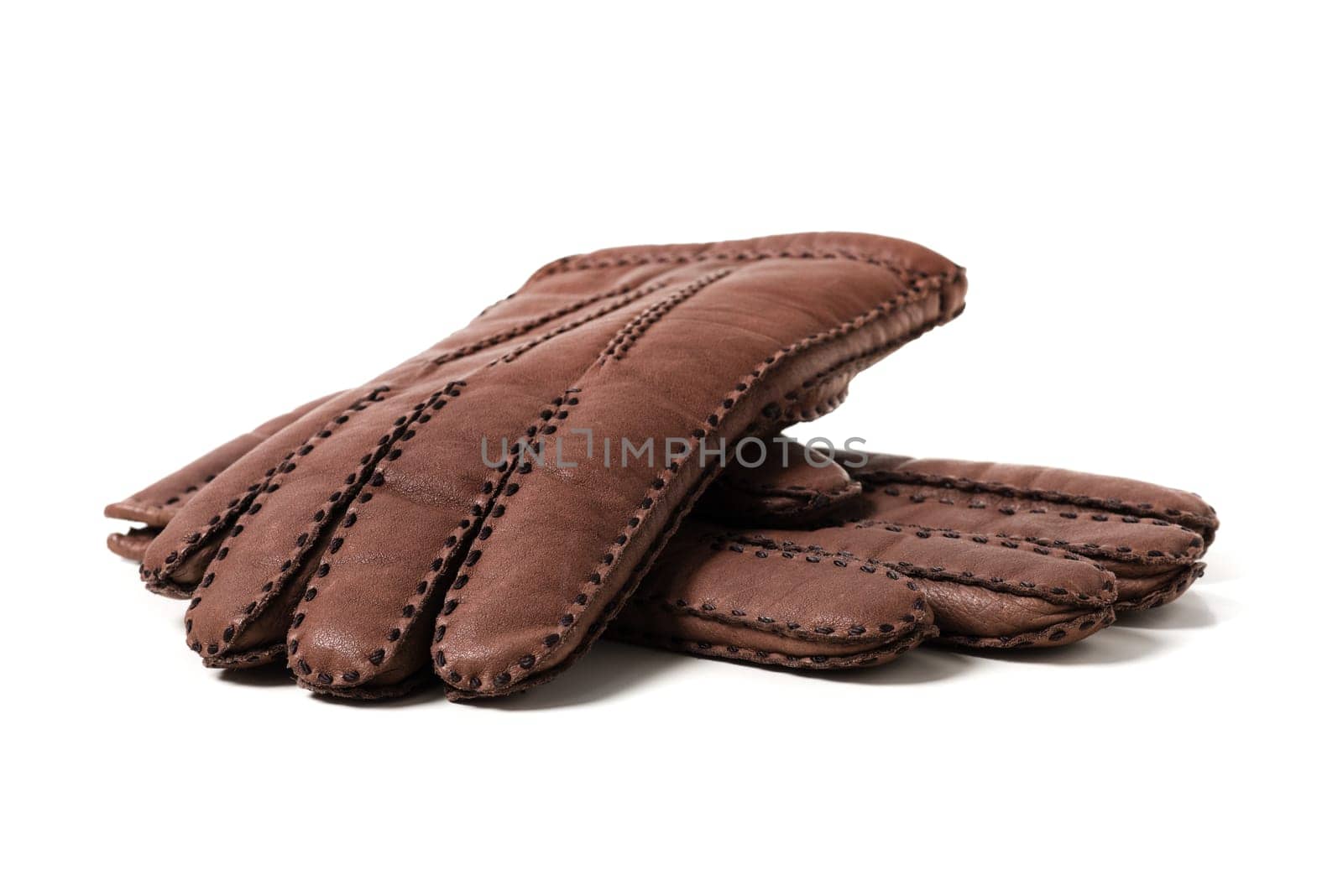Pair of men's brown leather gloves with accent stitching in dark brown over white background.