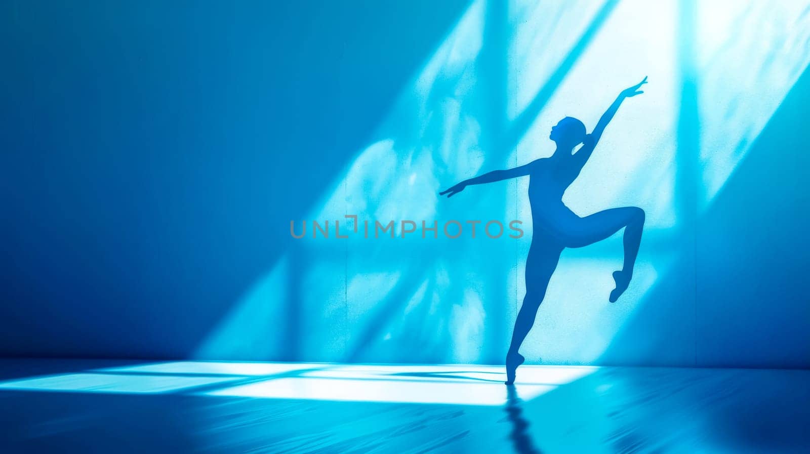 Ballet dancer's silhouette against a vibrant blue backdrop, expressing motion and poise