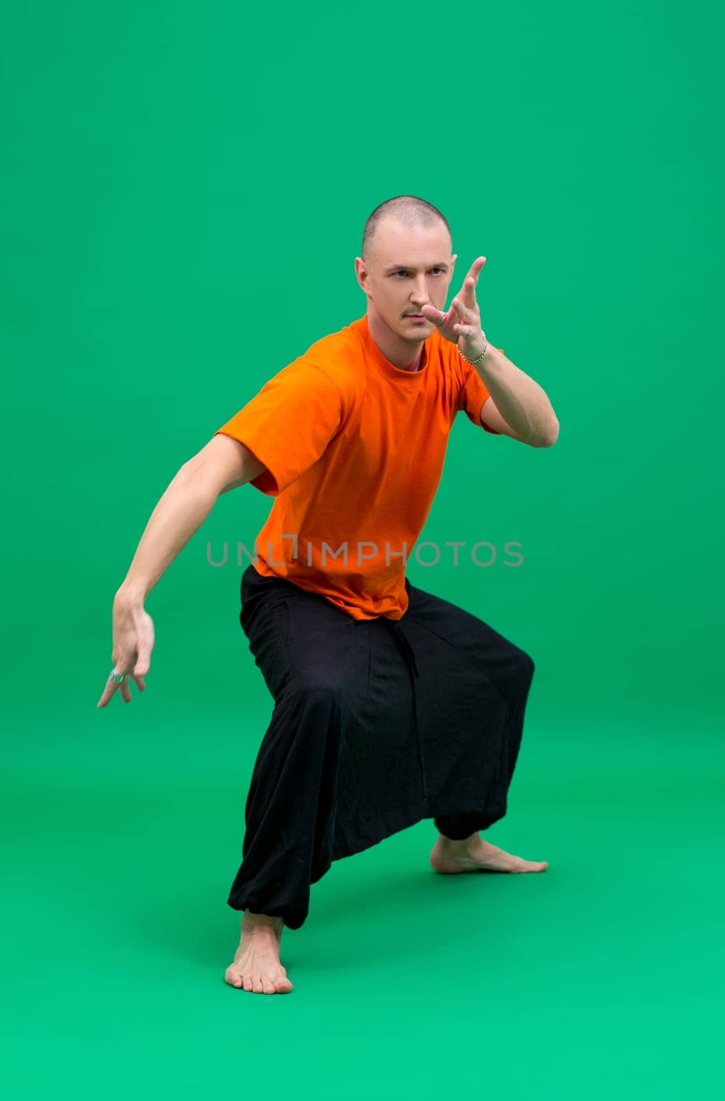 Image of middle-aged yogi doing asana by rivertime
