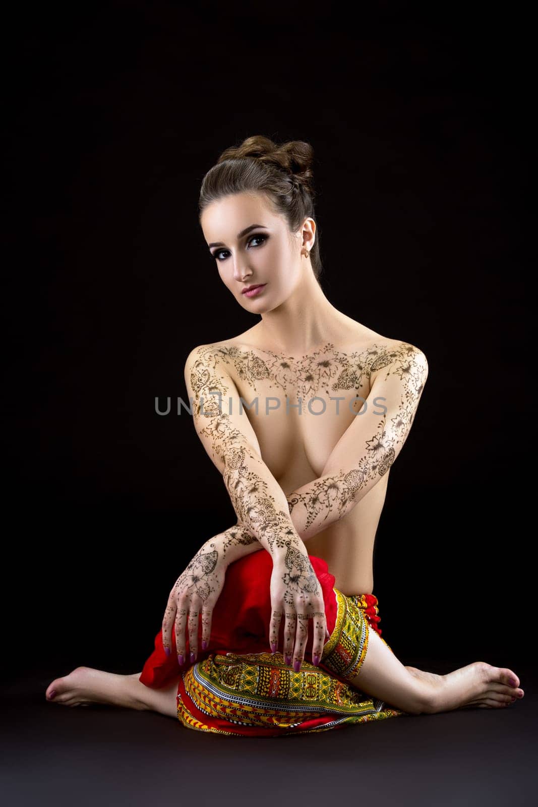 Topless woman with mehendi on chest and shoulders by rivertime