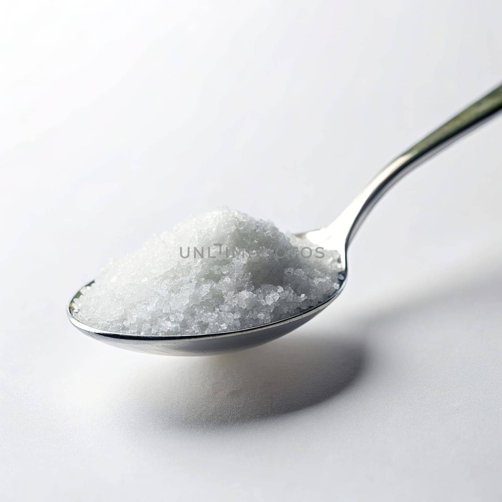 Sugar in a spoon on background, close-up. isolated. Food concept.