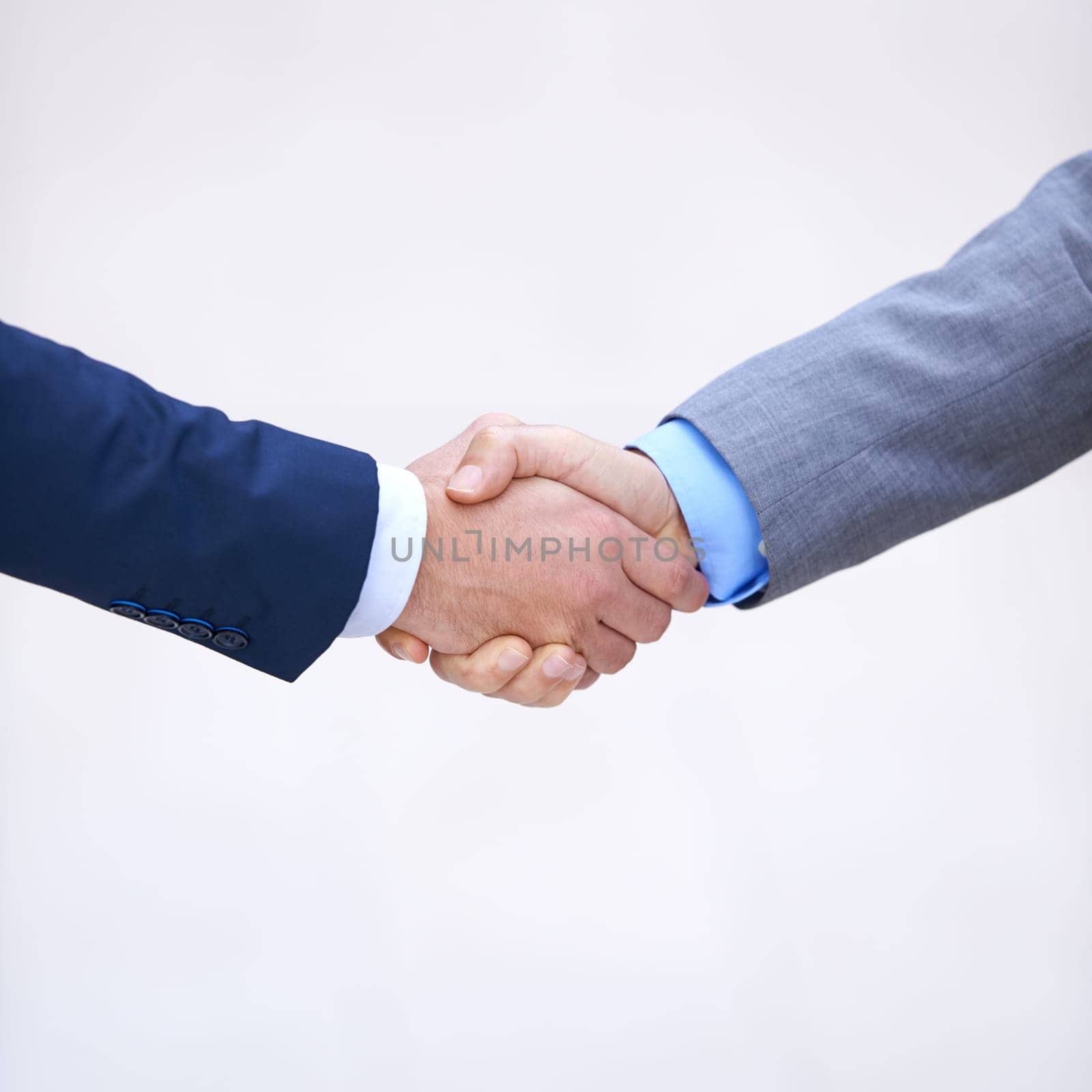 Closeup, business people and handshake for partnership deal, collaboration and b2b agreement for consultant. Welcome, introduction and shaking hands in studio isolated on a white background mockup by YuriArcurs