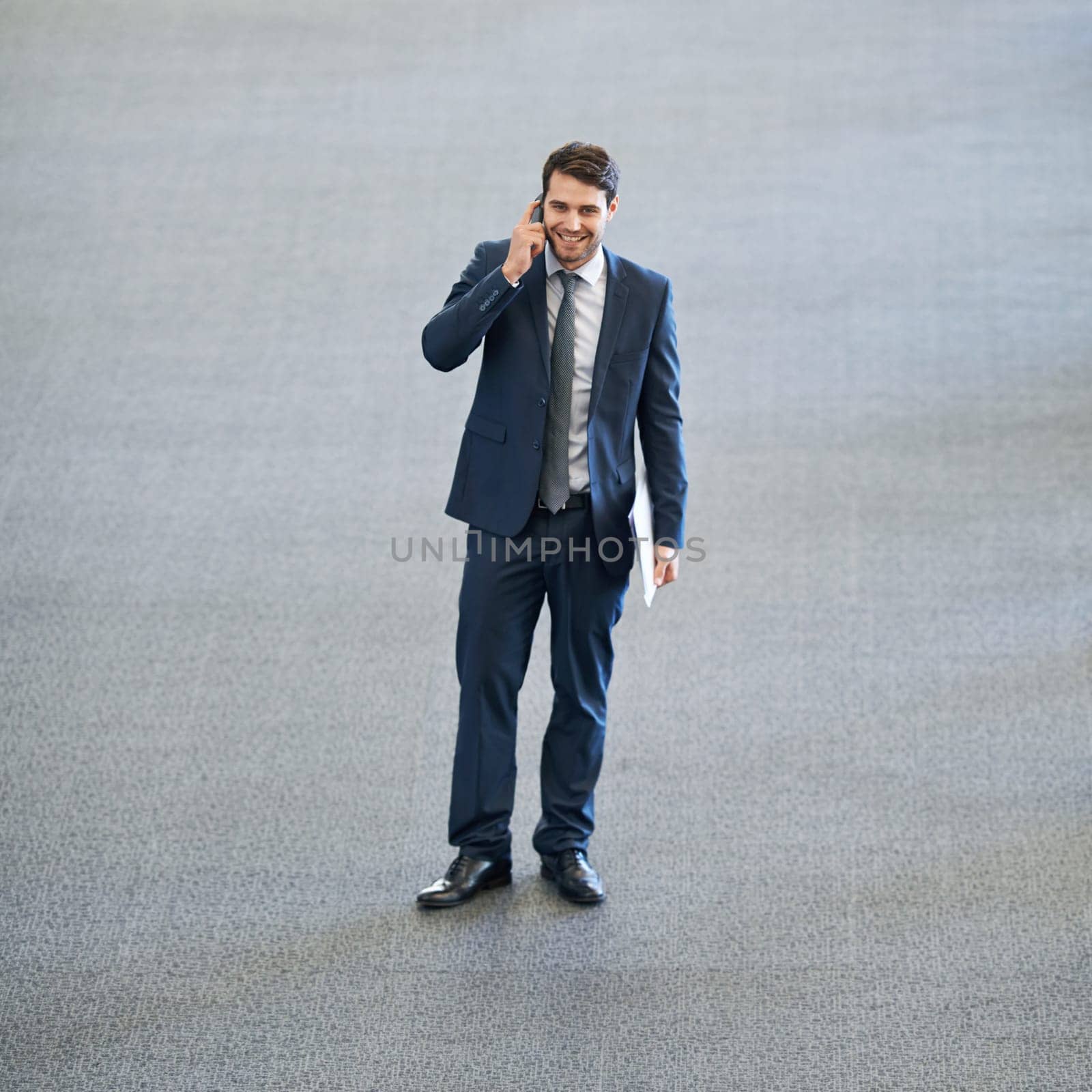 Mockup, talking or happy businessman on a phone call in office networking or speaking to chat in discussion. Space, planning or male entrepreneur in conversation, mobile communication or deal offer by YuriArcurs